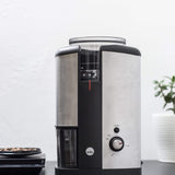 silver wilfa svart electric coffee grinder sitting on black countertop
