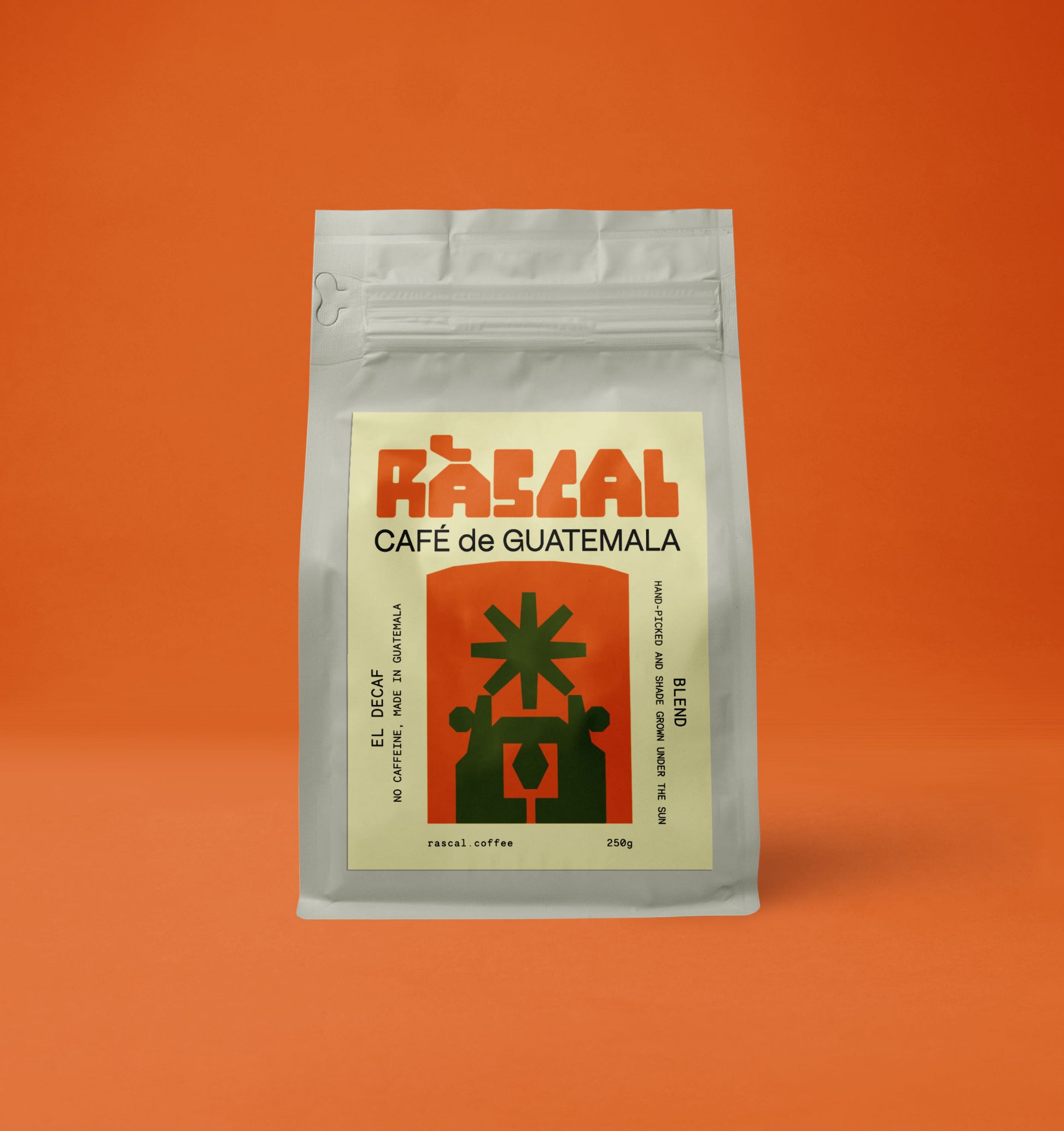 A packaged bag of Ráscal decaf Guatemala coffee with a brutalist graphic on the label.